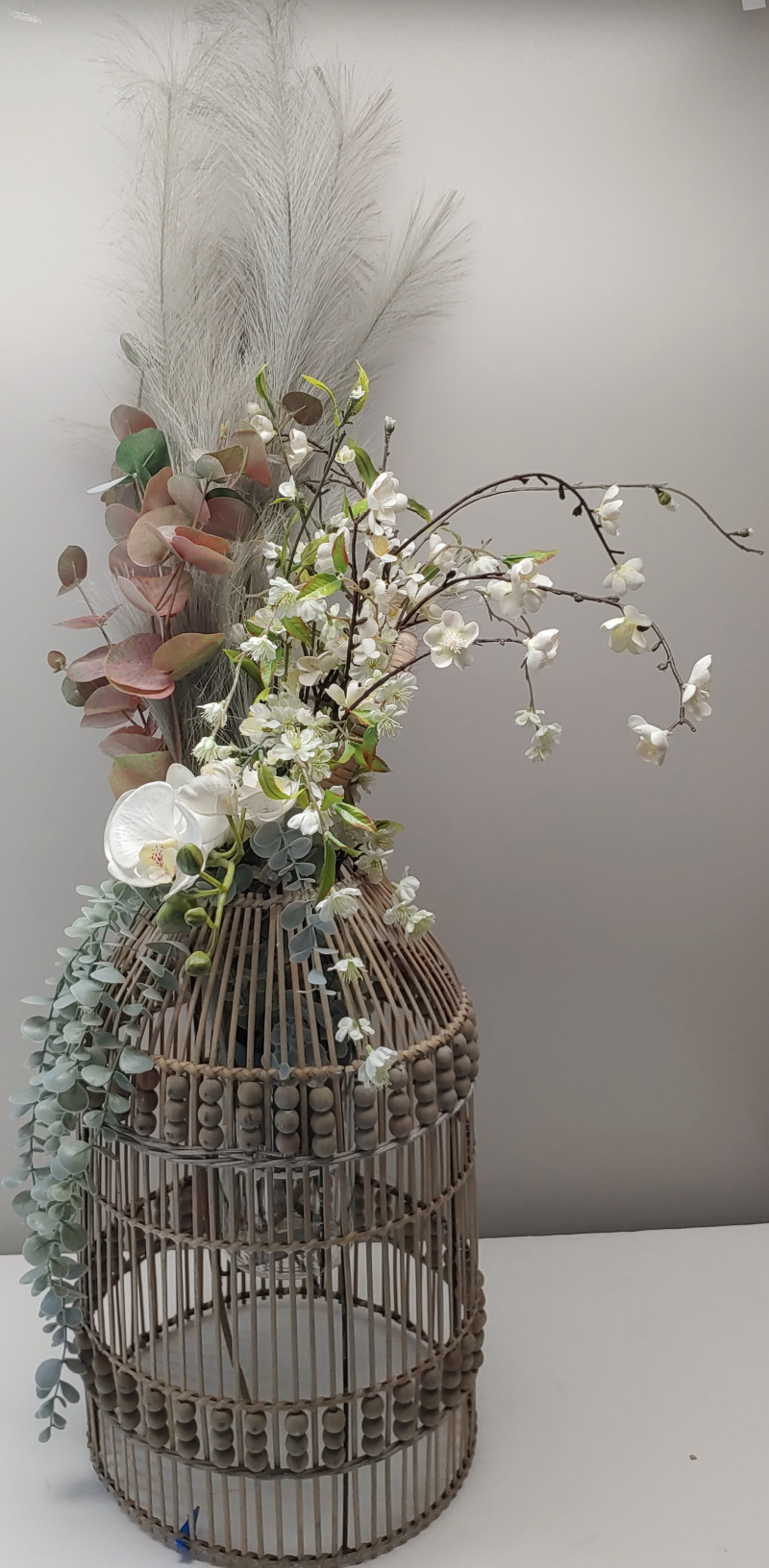 Flowers In Wicker Vase